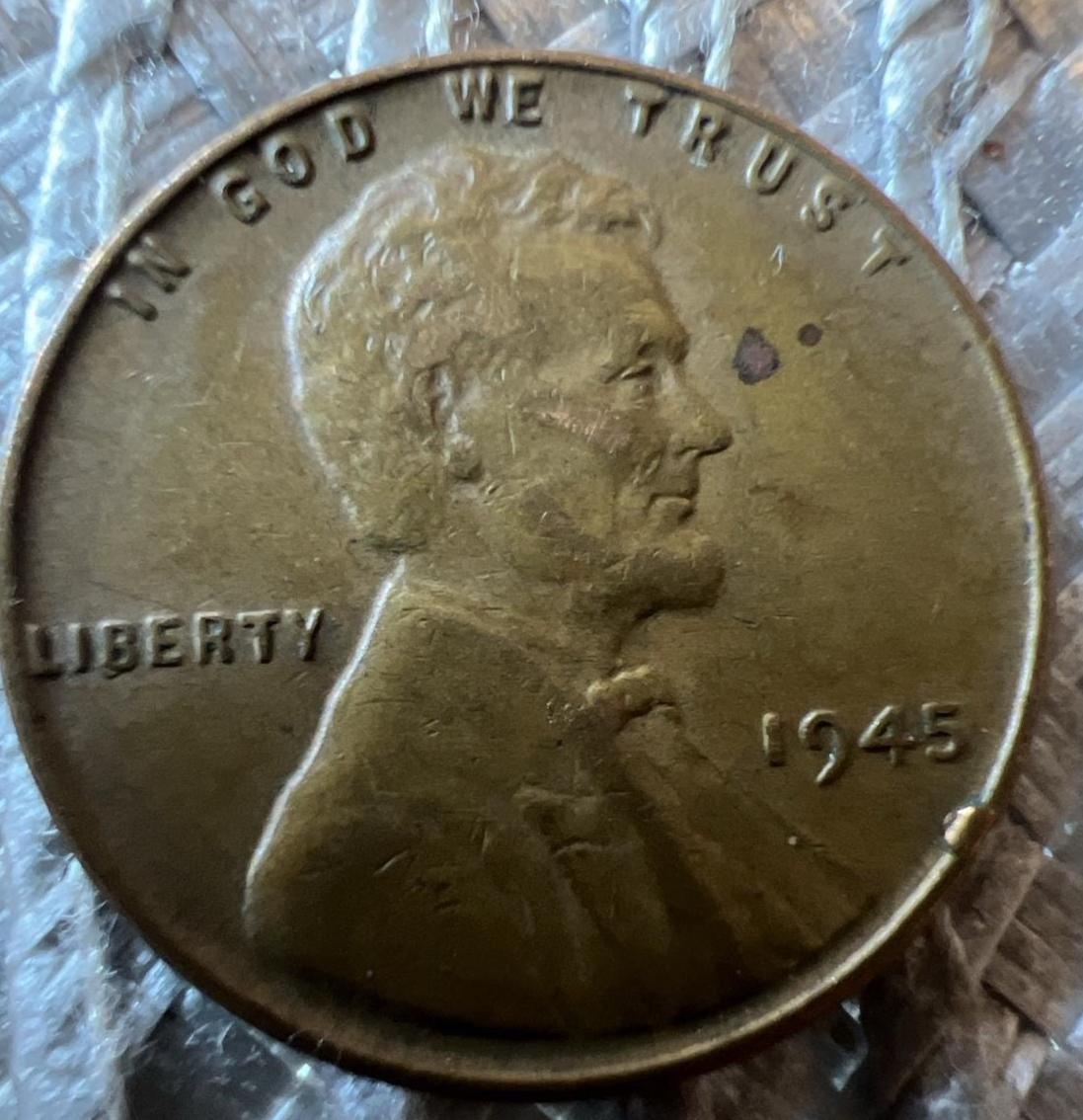 1945 wheat penny die break cud error showing raised blob of copper along rim where die cracked during production