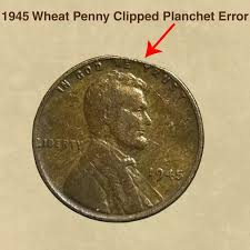 1945 wheat penny clipped planchet error showing elliptical clip on coin edge with weak opposite rim and normal penny for comparison